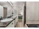 Ensuite bathroom featuring tile floors, granite countertops, and tub/shower combo at 588 Peachtree Se Dr, White, GA 30184