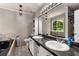 Double sink bathroom featuring tile flooring, granite countertops, and a tub at 588 Peachtree Se Dr, White, GA 30184