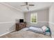 Neutral bedroom featuring neutral carpet, beige walls, ceiling fan and a nice window at 588 Peachtree Se Dr, White, GA 30184