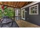 The covered deck, with access to the main house, offers outdoor living space for relaxation or entertainment at 588 Peachtree Se Dr, White, GA 30184