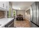 Dining room with view from kitchen featuring stainless steel refrigerator and tiled floors at 588 Peachtree Se Dr, White, GA 30184