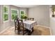 Cozy dining area filled with natural light, perfect for Gathering meals and gatherings at 588 Peachtree Se Dr, White, GA 30184