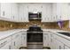 Updated kitchen boasts stainless steel appliances and ample counter space at 588 Peachtree Se Dr, White, GA 30184