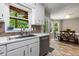 Eat-in kitchen features stainless steel appliances, breakfast table, and view to the outdoors at 588 Peachtree Se Dr, White, GA 30184