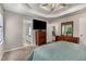 Main bedroom boasts a ceiling fan, carpet, and ensuite bath at 588 Peachtree Se Dr, White, GA 30184