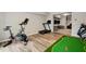 Well equipped finished basement with golf putting green, exercise bike, and treadmill at 690 Cobblestone Creek Ln, Mableton, GA 30126