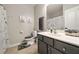Well-lit bathroom with gray vanity, shower/tub, and decorative accents for a stylish design at 690 Cobblestone Creek Ln, Mableton, GA 30126