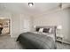 Bedroom boasts soft carpet, neutral walls, and a stylish bed with bedside tables and lamps at 690 Cobblestone Creek Ln, Mableton, GA 30126