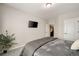 Modern bedroom with carpet, tv, closet, and door at 690 Cobblestone Creek Ln, Mableton, GA 30126