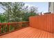 Wood deck with wooden railing offers a cozy outdoor space at 690 Cobblestone Creek Ln, Mableton, GA 30126