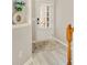 Entryway featuring light gray paint, wood floors, and a partially visible white front door at 690 Cobblestone Creek Ln, Mableton, GA 30126