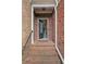 The entryway features brick steps, a brick door surround, and a black front door at 690 Cobblestone Creek Ln, Mableton, GA 30126