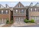 Exterior of a home featuring stone accents, brick accents, and an attached garage at 690 Cobblestone Creek Ln, Mableton, GA 30126