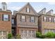 Exterior of a charming home featuring stone and brick accents, plus an attached garage at 690 Cobblestone Creek Ln, Mableton, GA 30126
