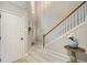 Foyer with wood floors and stairs with white banister at 690 Cobblestone Creek Ln, Mableton, GA 30126