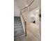 Foyer featuring carpeted stairs, wood floors, and a white stair railing with wood accents at 690 Cobblestone Creek Ln, Mableton, GA 30126