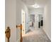Upstairs hallway with carpeted floor, linen closet and access to bedrooms at 690 Cobblestone Creek Ln, Mableton, GA 30126