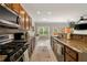 Bright kitchen featuring stainless steel appliances, granite countertops and eat-in breakfast area at 690 Cobblestone Creek Ln, Mableton, GA 30126