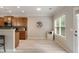 Open kitchen space with breakfast bar, stainless appliances and access to backyard at 690 Cobblestone Creek Ln, Mableton, GA 30126