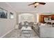 Open-concept living space seamlessly connects to the dining area, featuring neutral decor and modern finishes at 690 Cobblestone Creek Ln, Mableton, GA 30126