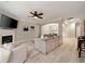 Bright living room with a fireplace, ceiling fan, and an open layout at 690 Cobblestone Creek Ln, Mableton, GA 30126