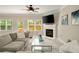 Bright living room with fireplace, large windows and hardwood floors at 690 Cobblestone Creek Ln, Mableton, GA 30126