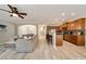 Open-concept living room and kitchen with hardwood floors, granite counters, wooden cabinets, and stainless appliances at 690 Cobblestone Creek Ln, Mableton, GA 30126