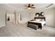Large main bedroom with tray ceiling, ceiling fan, and ample space for a sitting area at 690 Cobblestone Creek Ln, Mableton, GA 30126