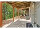 This concrete patio has an outdoor ceiling and features a walkout and a wooded area view at 690 Cobblestone Creek Ln, Mableton, GA 30126