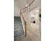 Carpeted stairs with wood banister leading to the second floor at 690 Cobblestone Creek Ln, Mableton, GA 30126