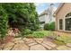 Relaxing backyard with stone patio, beautiful pond, and mature trees surrounding the house at 1545 Center Cross Pass, Marietta, GA 30062