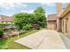 A backyard featuring a stone patio, landscaping, and the rear of the house at 1545 Center Cross Pass, Marietta, GA 30062