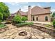 The backyard features a stone patio, mature landscaping, and the rear of the house at 1545 Center Cross Pass, Marietta, GA 30062