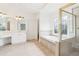 Bathroom featuring a soaking tub, stained-glass window, tiled floors and a glass shower at 1545 Center Cross Pass, Marietta, GA 30062