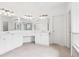 Bathroom with tile floors, double vanities, and large mirrors and lighting at 1545 Center Cross Pass, Marietta, GA 30062