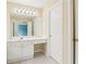 Bathroom featuring a large mirror, vanity with storage, tile floors, and a light fixture at 1545 Center Cross Pass, Marietta, GA 30062