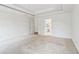 Spacious carpeted bedroom with ceiling detail, leading into the bathroom and closet at 1545 Center Cross Pass, Marietta, GA 30062
