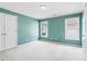 Spacious bedroom with blue walls and carpet floors, featuring two windows with blinds at 1545 Center Cross Pass, Marietta, GA 30062