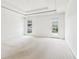 Spacious bedroom with a tray ceiling and carpeted floor, and backyard access at 1545 Center Cross Pass, Marietta, GA 30062