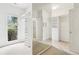 Bright walk-in closet features custom built-in shelving, a window, and carpet floors at 1545 Center Cross Pass, Marietta, GA 30062