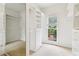 Walk-in closet offers built-in shelving, drawers, a carpet floor, and natural light at 1545 Center Cross Pass, Marietta, GA 30062