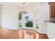 Charming dining area features hardwood floors, bright windows, and stylish light fixture at 1545 Center Cross Pass, Marietta, GA 30062