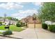 Inviting brick home with a two-car garage, lush green lawn, and classic architectural design in a lovely neighborhood at 1545 Center Cross Pass, Marietta, GA 30062