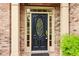 Elegant front door with decorative glass and sidelights, framed by brick columns at 1545 Center Cross Pass, Marietta, GA 30062
