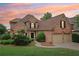 Charming brick home with a well-manicured lawn and a two-car garage, offering classic curb appeal at 1545 Center Cross Pass, Marietta, GA 30062