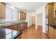 Bright kitchen features granite countertops, stainless steel appliances, and hardwood floors at 1545 Center Cross Pass, Marietta, GA 30062