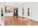 Open floor plan kitchen features wood floors, modern cabinets, and stainless steel appliances at 1545 Center Cross Pass, Marietta, GA 30062