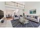 Bright living room featuring high ceilings, plush seating, and modern decor, with a view of the dining area at 1545 Center Cross Pass, Marietta, GA 30062