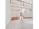 Open-concept living area with a balcony, dining space, and a staircase in a neutral color palette at 1545 Center Cross Pass, Marietta, GA 30062