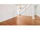 A living room featuring hardwood floors and stairs with a decorative column at 1545 Center Cross Pass, Marietta, GA 30062